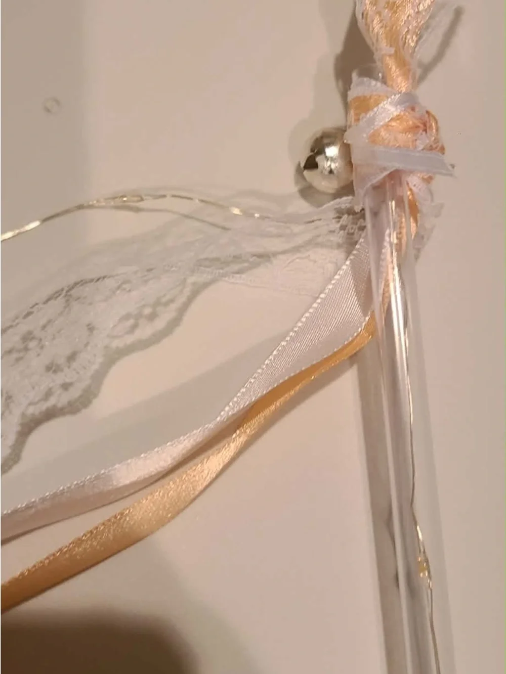 50 individually wrapped LED wands with Champagne ribbon and white lace with bell